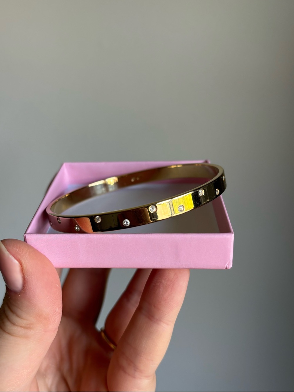 Swarovski gold toned bangle cuff with crystal stones 9” around
